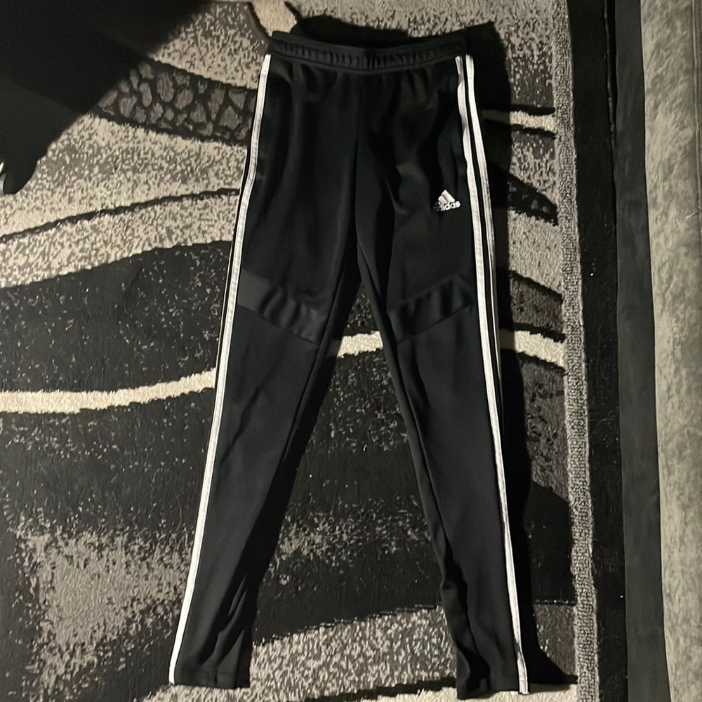 Black and white adidas pants with zip up sides, size XS, never worn